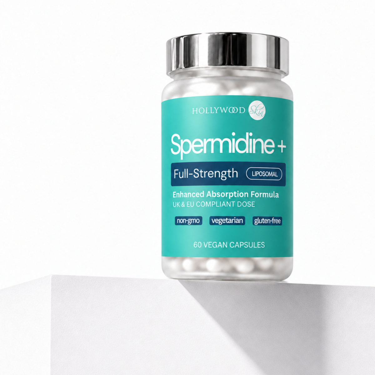 Spermidine+ bottle with a silver cap on a white ledge.