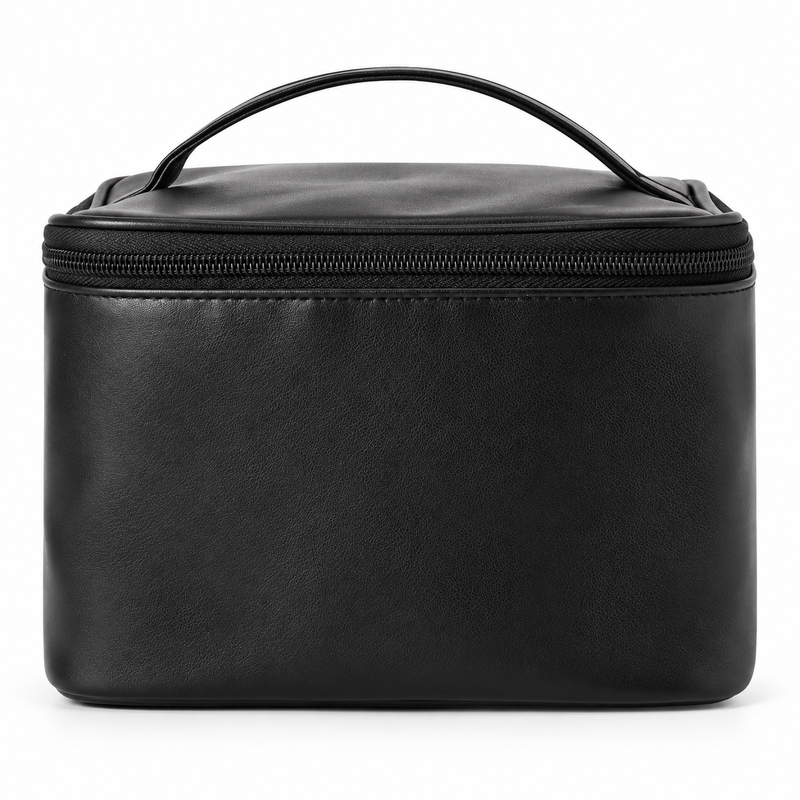 Soft Spell black PU makeup bag with carrying handle and zip closure on a white background.